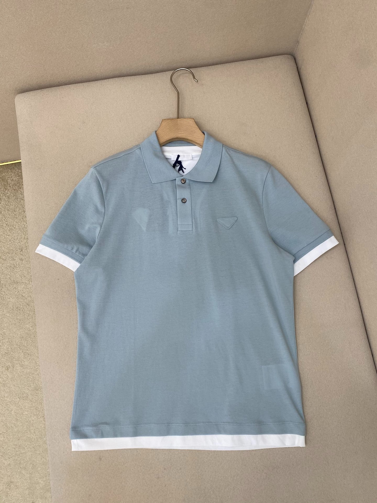 프*다 25SS 삼각 로고 면 폴로 셔츠